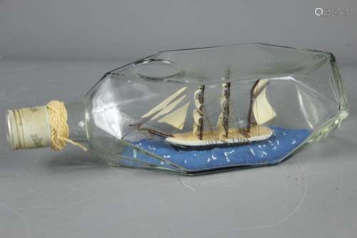 An Early 20th Century Ship in a Bottle, approx 15 cms l