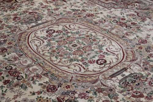 A Large Wool Carpet, the carpet has an overall floral motif, pink central design with green highlights set on a cream and beige background, approx 245 x 340 cms