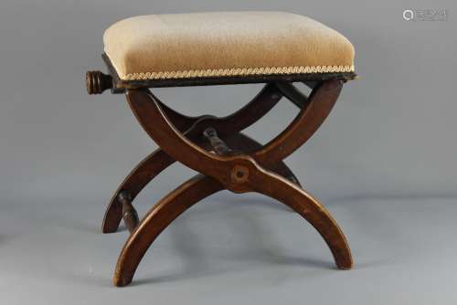 An Edwardian Mahogany X-frame Piano Stool; the adjustable stool is has a beige velvet covered seat, approx 46 x 34 x 48 cms