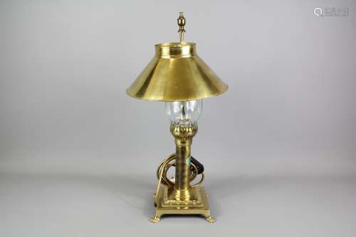 A Brass Table Lamp; the lamp having a brass shade and glass funnel,  approx 16 x 41 cms