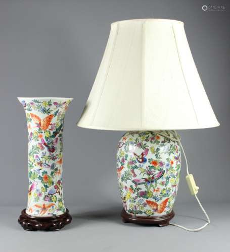 A 20th Century Chinese Famille Rose Lamp Base; the base profusely painted with butterflies and flowers, on a wooden base, approx 35 cms from base to fitting, together with a similar pillar vase, approx 41