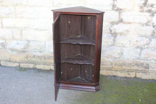 Antique Oak Corner Cupboard; the cupboard having three inner shelves, brass fittings, central spice drawer beneath, approx 71 x 44 x 105 cms