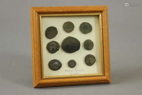 Early Roman Coins and Anglo Saxon Sceat, one large coin surrounded by eight smaller coins