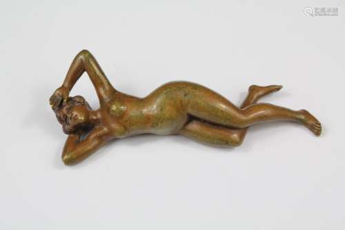 A Continental Bronze Feminine Nude Figurine, depicted reclining, approx 9 cms l