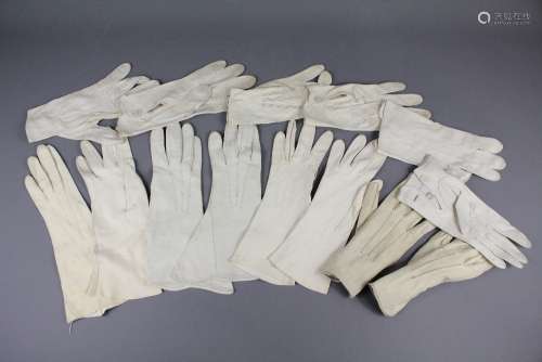 Seven Pairs of Cream Vintage Kid Gloves; some of the gloves are three quarter length, others wrist length together with a quantity of cotton gloves