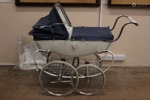 A Silver Cross Infants Carriage, with navy trim and chrome fittings