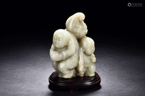 A CELADON JADE 'TWO BOYS AND GOURD' CARVING