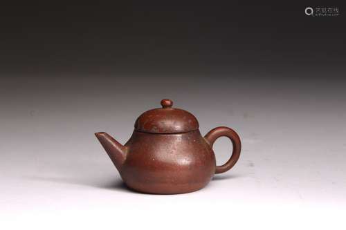 A SMALL YIXING CLAY TEAPOT