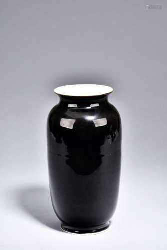 A BLACK GLAZED VASE