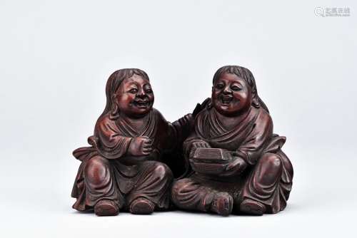 A HARDWOOD CARVING OF TWO IMMORTALS