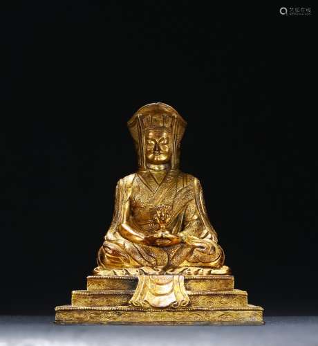 A GILT BRONZE STATUE OF LAMA