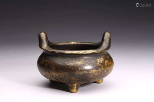 A BRONZE TRIPOD CENSER