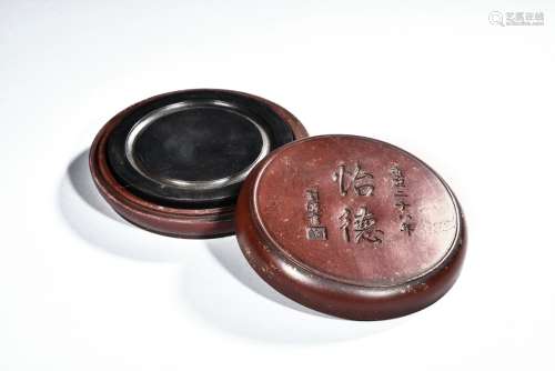 A CIRCULAR INKSTONE WITH CASE