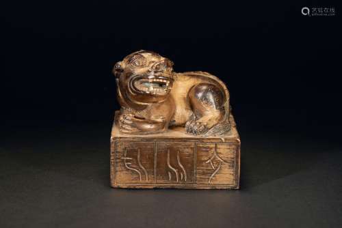 A GILT BRONZE BRONZE SEAL WITH LION-SHAPED TOP
