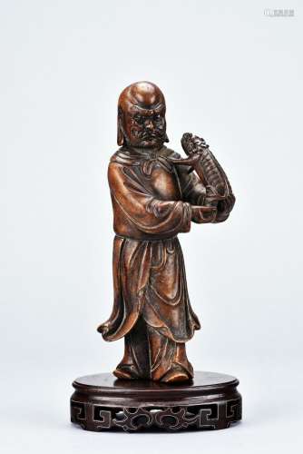 A SHOUSHAN CARVED FIGURE OF ARHAT