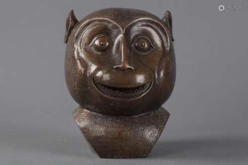 A BRONZE CAST MONKEY HEAD