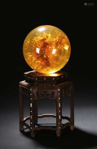 A YELLOW AMBER-LIKE GLOBE DISPLAY