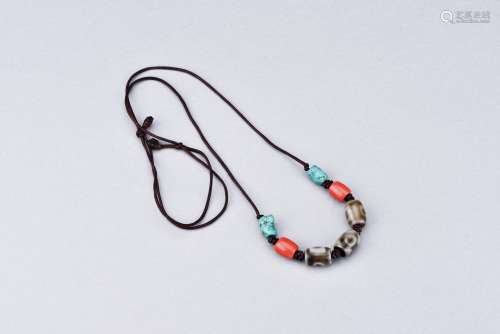 A DZI BEAD AND TURQUOISE NECKLACE