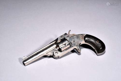 AN ANTIQUE 1877 SMITH & WESSON REVOLVER