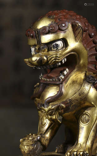 a pair of copper and gold lion ornament