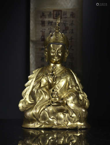 Copper and gold Buddha statue