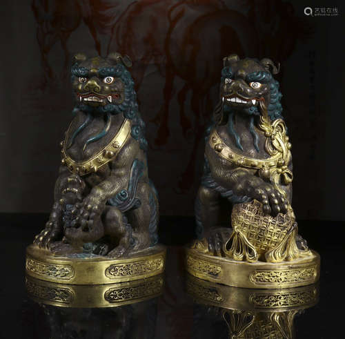 a pair of copper and gold lion ornament