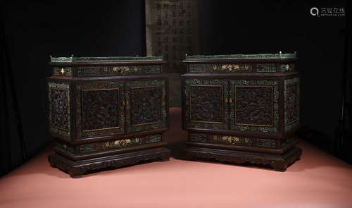 a pair of rosewood square makeup box