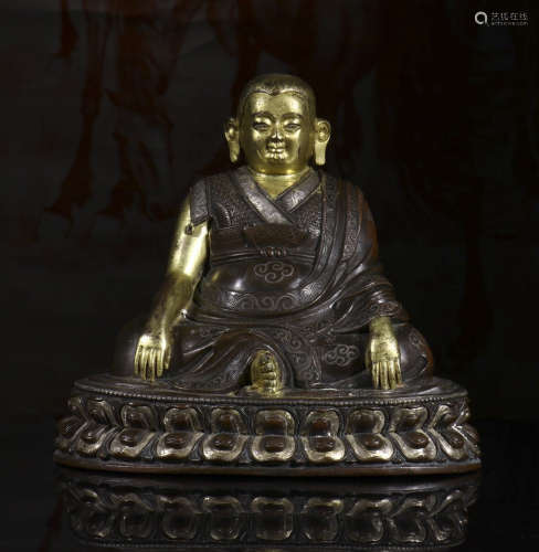 copper and gold buddha statue