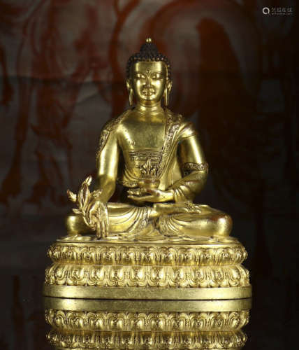 copper and gold Buddha statue