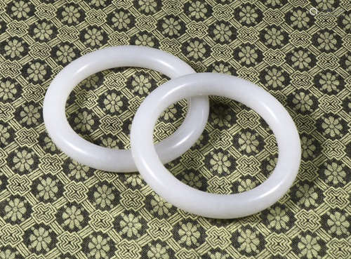 a pair of Chaise bracelets