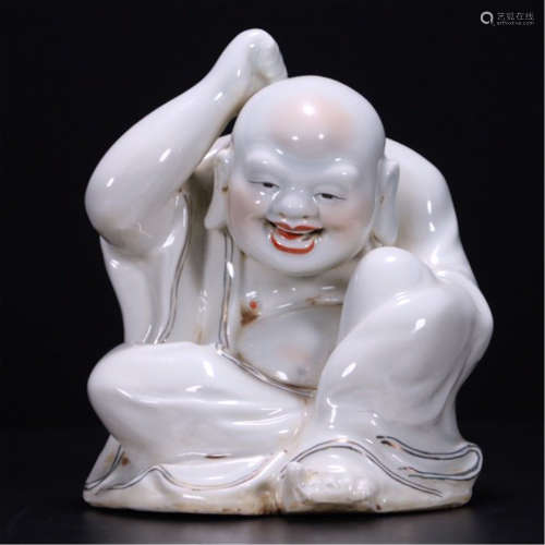 A CHINESE WHITE UNDER GLAZE LOHAN SEATED TABLE ITEM