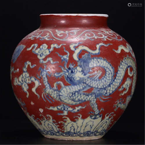 A CHINESE PORCELAIN RED UNDER GLAZE BLUE DRAGON JAR