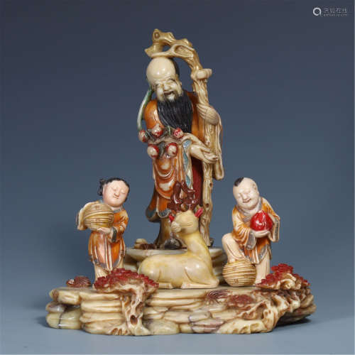 A CHINESE COLOR PAINTED SOAPSTONE MAN AND BOY TABLE ITEM
