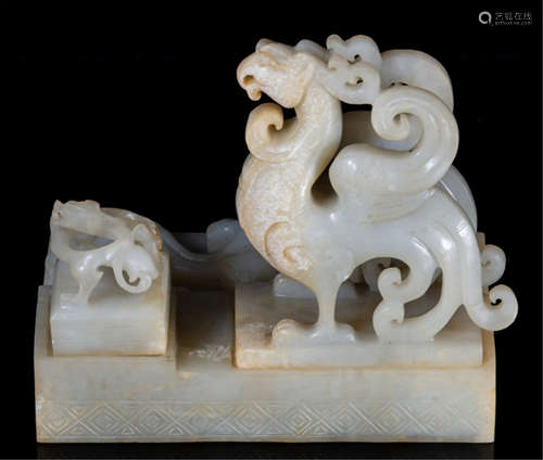 A PAIR OF HETIAN JADE BEAST SEALS