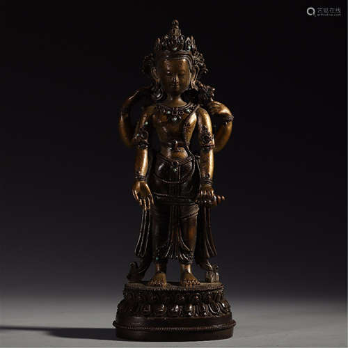 A CHINESE BRONZE FOUR ARMS STAND GUANYIN