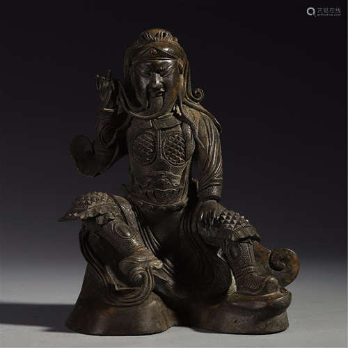 A CHINESE BRONZE SEATED WARRIOR