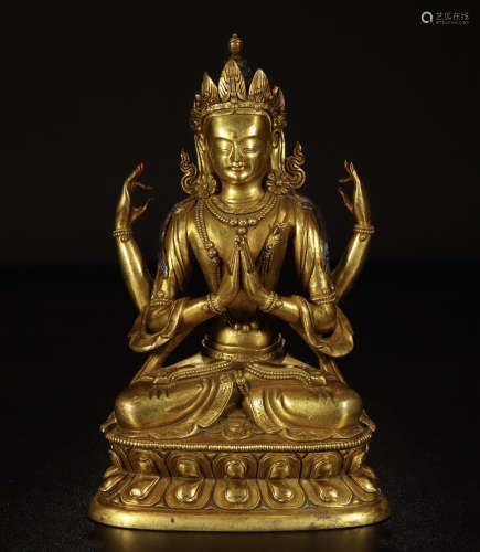 A CHINESE GILT BRONZE WITH FOUR ARMS SEATED GUANYIN