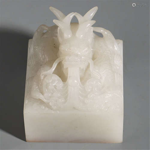 A CHINESE WHITE JADE DRAGON SEAL