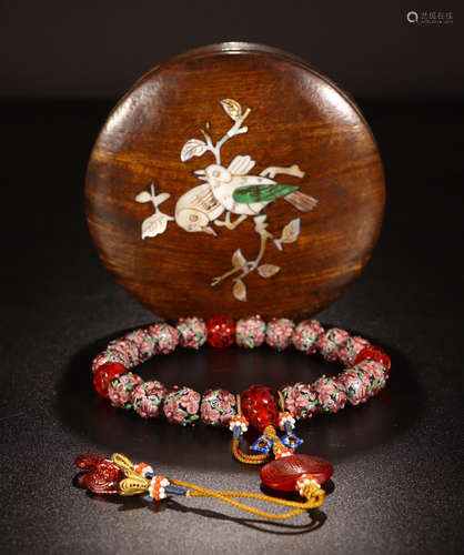 A CHINESE COLOURED GLAZE COURT BEAD BRACELET