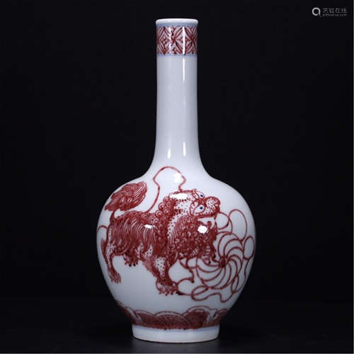 A CHINESE PORCELAIN RED UNDER GLAZE LION STEM VASE