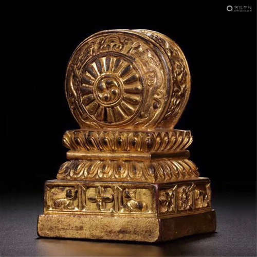 A CHINESE GILT BRONZE DOUBLE DRAGONS WHEEL ON LOTUS DEAL