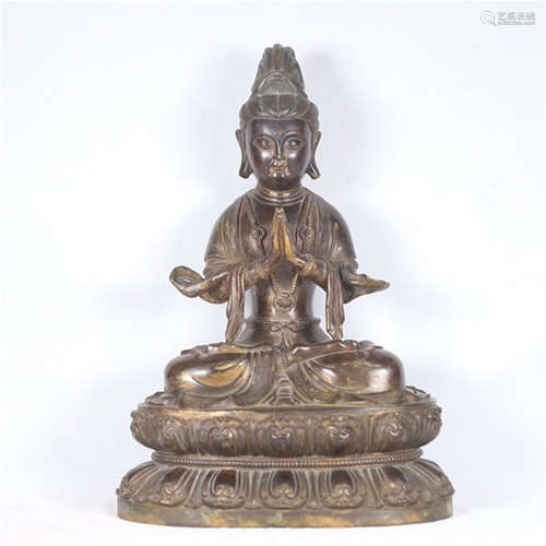 A CHINESE BRONZE SEATED GUANYIN WITH LOTUS