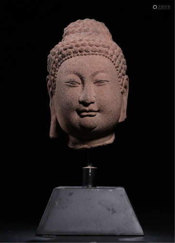 A CHINESE STONE BUDDHIST GUARDIAN HEAD