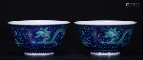 A PAIR OF CHINESE PORCELAIN BLUE AND WHITE GREEN UNDER GLAZE DRAGON BOWLS