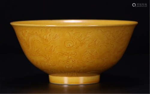 A CHINESE PORCELAIN YELLOW UNDER GLAZE DRAGON BOWL