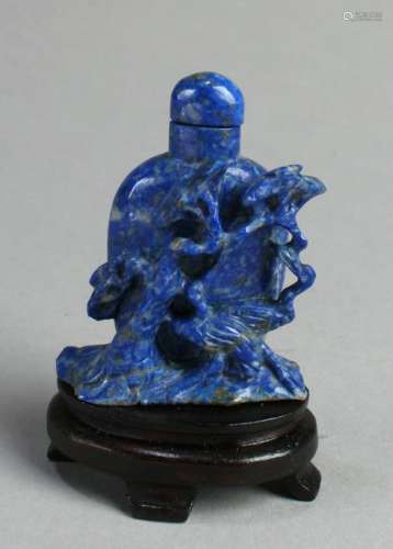 A Carved Lapis Snuff Bottle With Stand