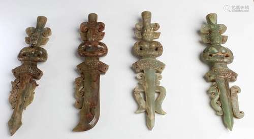 A Group of Four Jade Sword