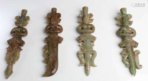 A Group of Four Jade Sword