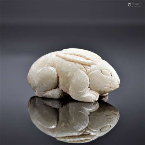 A STONE CARVED FIGURE OF RABBIT