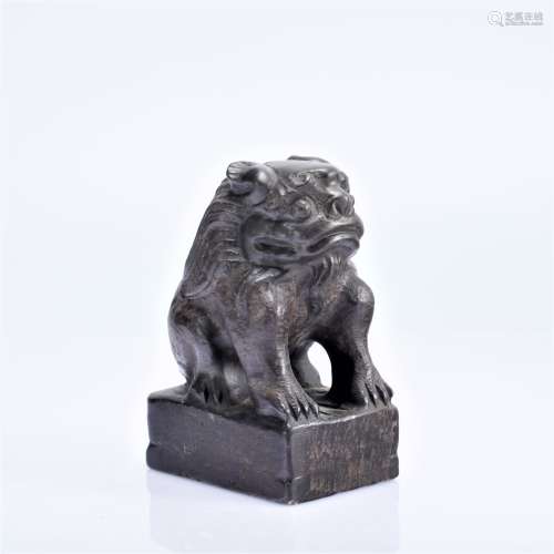 A STONE CARVED FIGURE OF LION